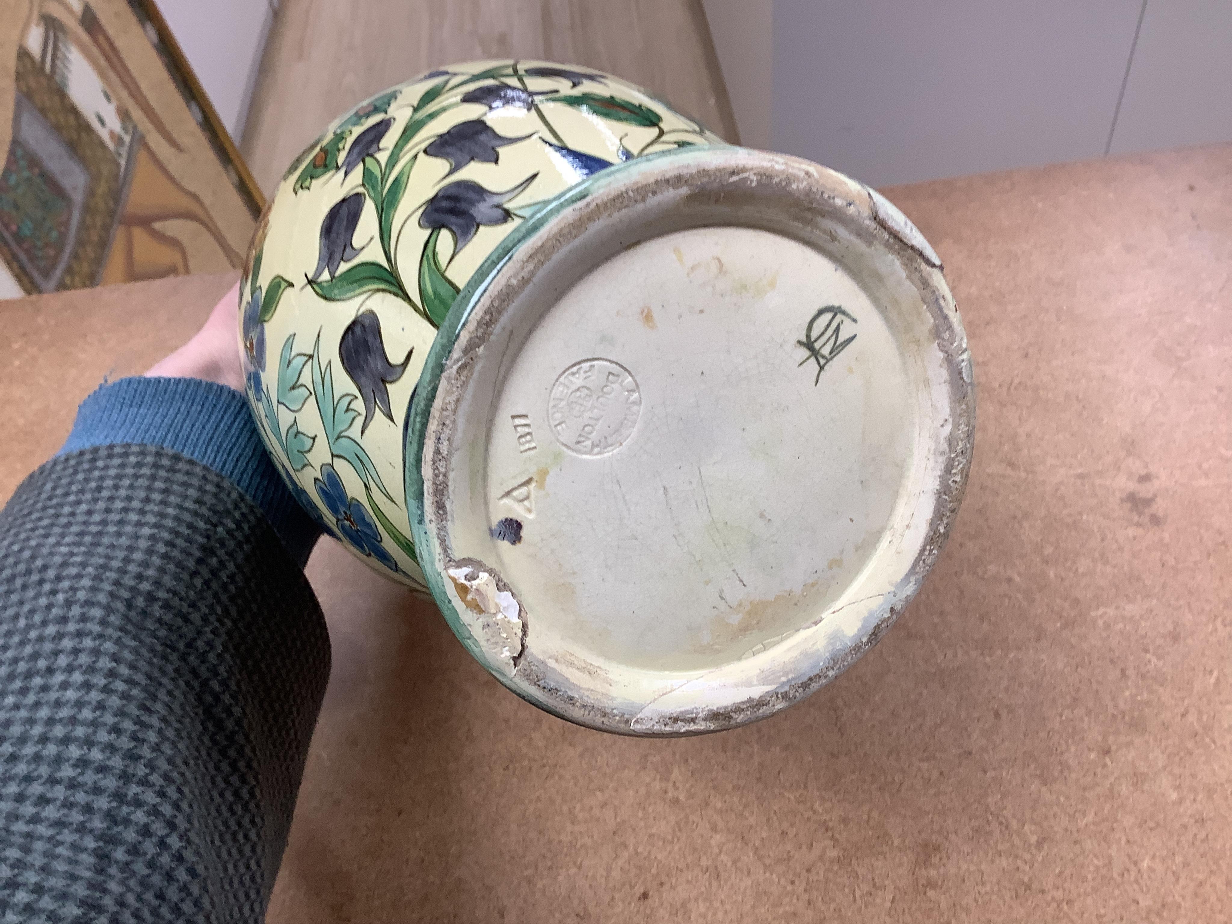 A pair of Doulton Lambeth Persian inspired faience vases, dated 1877, restored, 37cm high